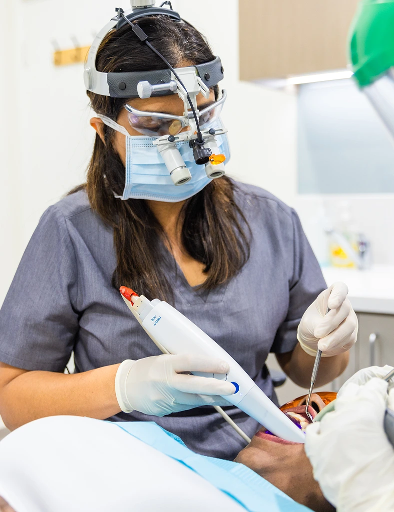 Dr. Harshada Vaishnav - cleaning teeth