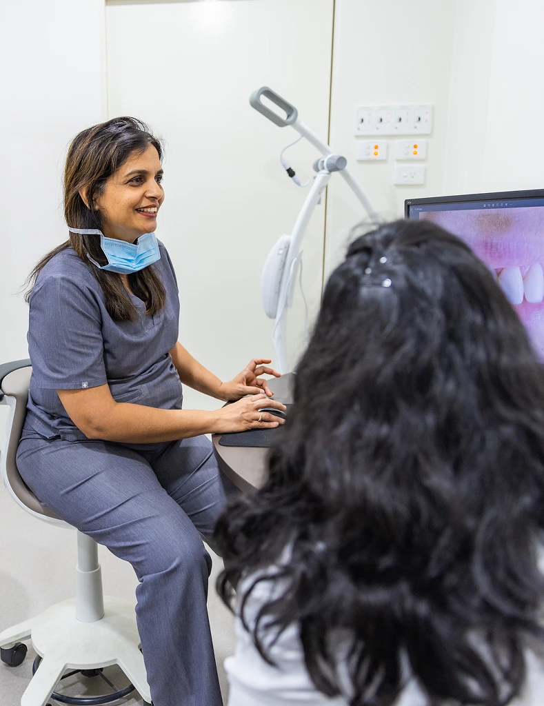 Dr. Harshada Vaishnav showing teeth whitening process